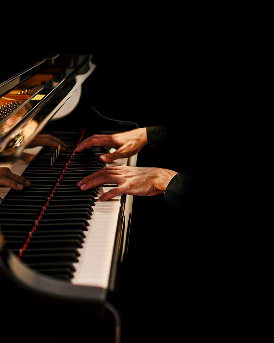 Pianist's hands performing live music